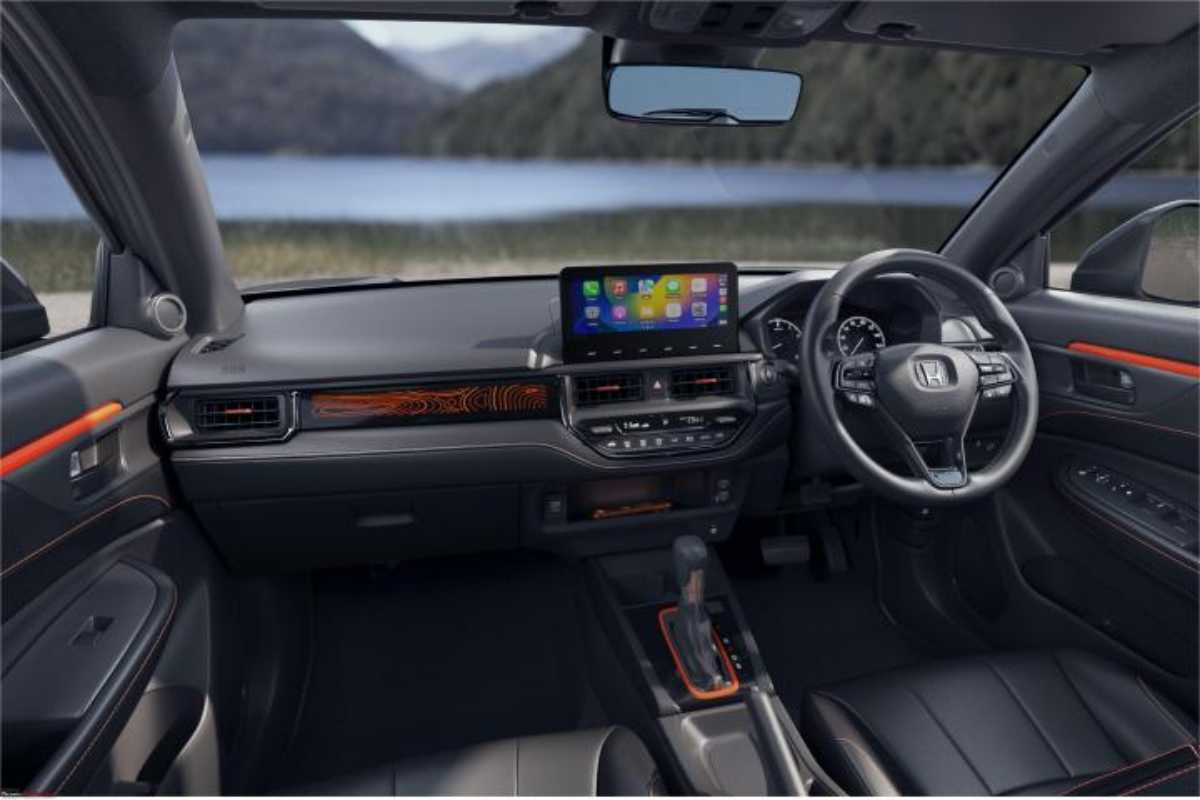 Honda Elevate ADV Edition interior dashboard with orange stitching on black seats and illuminated ADV Terrain Pattern garnish