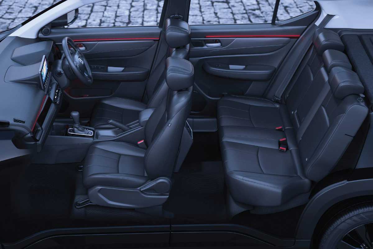 Honda Elevate ADV Edition interior dashboard with orange stitching on black seats and illuminated ADV Terrain Pattern garnish